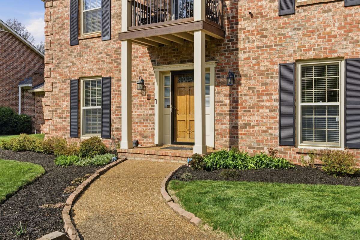 A two story porch welcomes you home.
