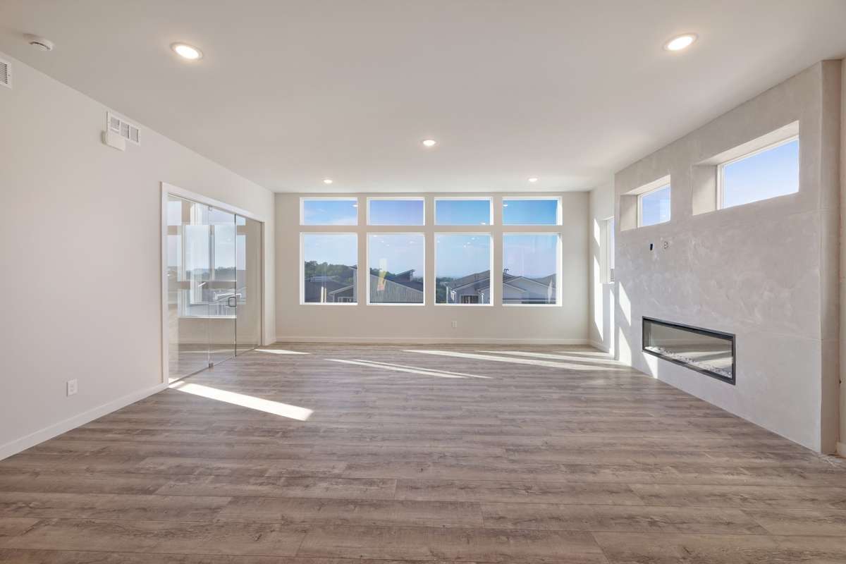 custom modern fireplaces in every living room.  City views peak around the rooftops across the street