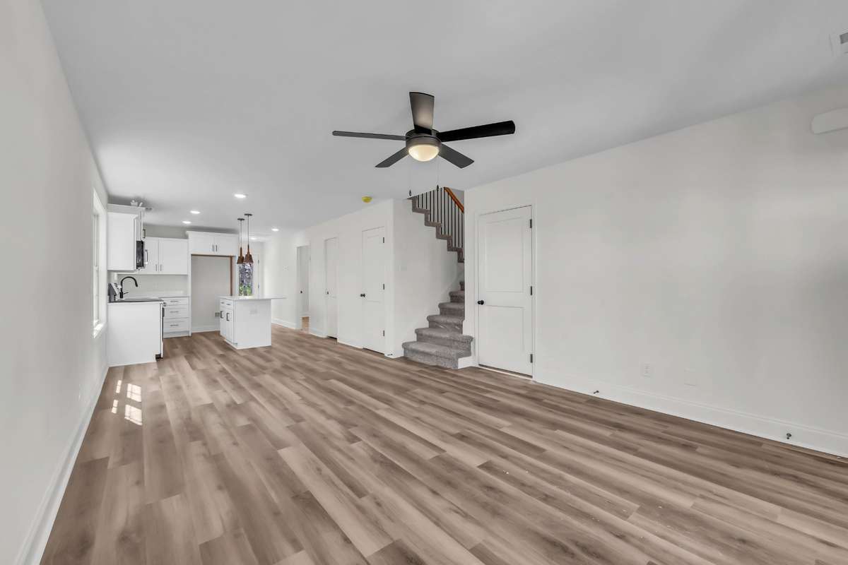 Large living room with open concept through the dining and into the kitchen