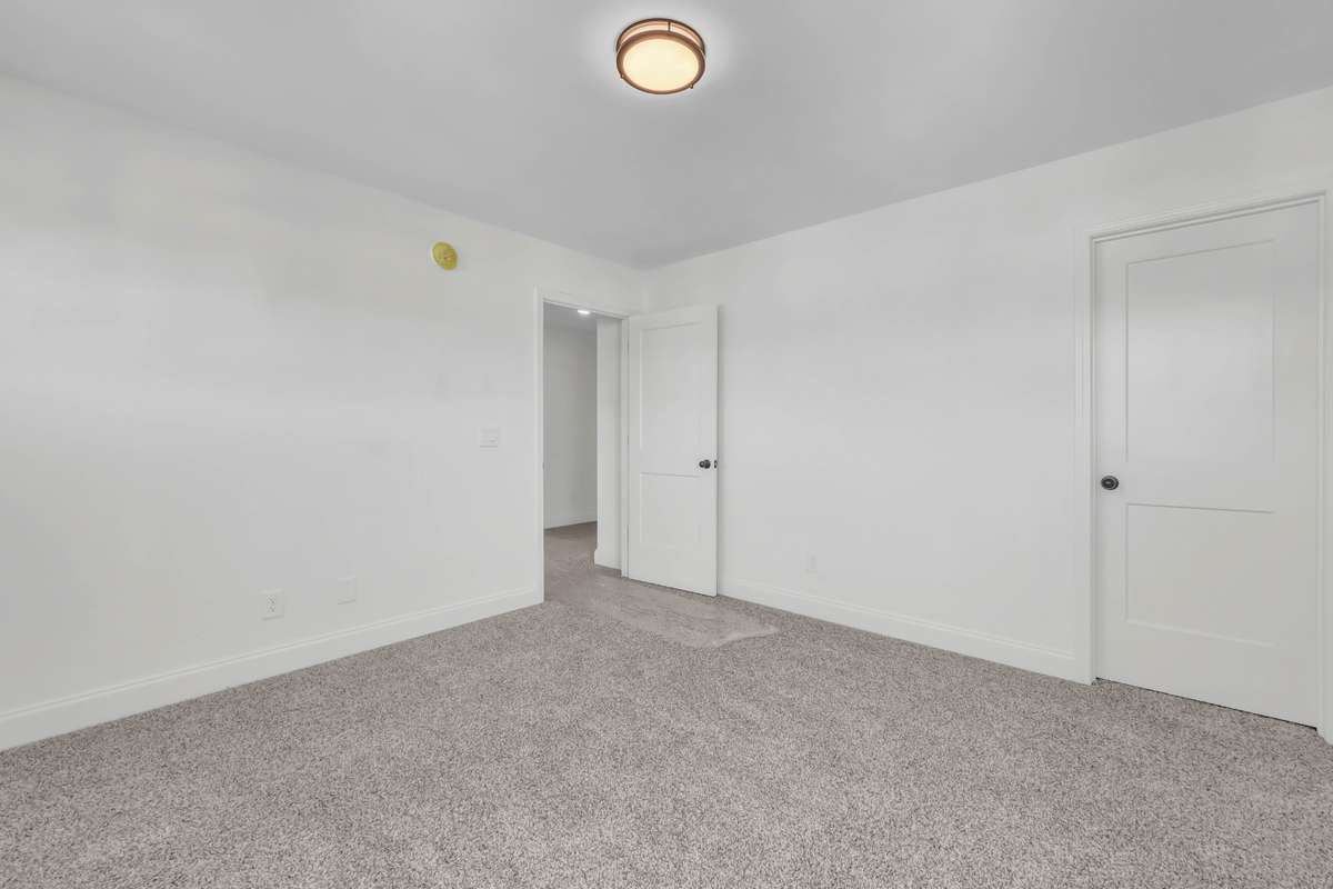 Large second bedroom upstairs with walk-in closet