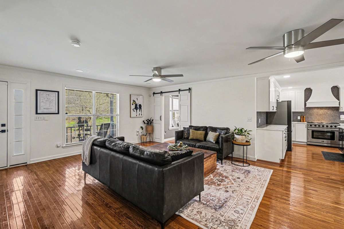 The main level of the home offers beautiful original hard wood floors throughout the living, kitchen, office, half bath & primary
