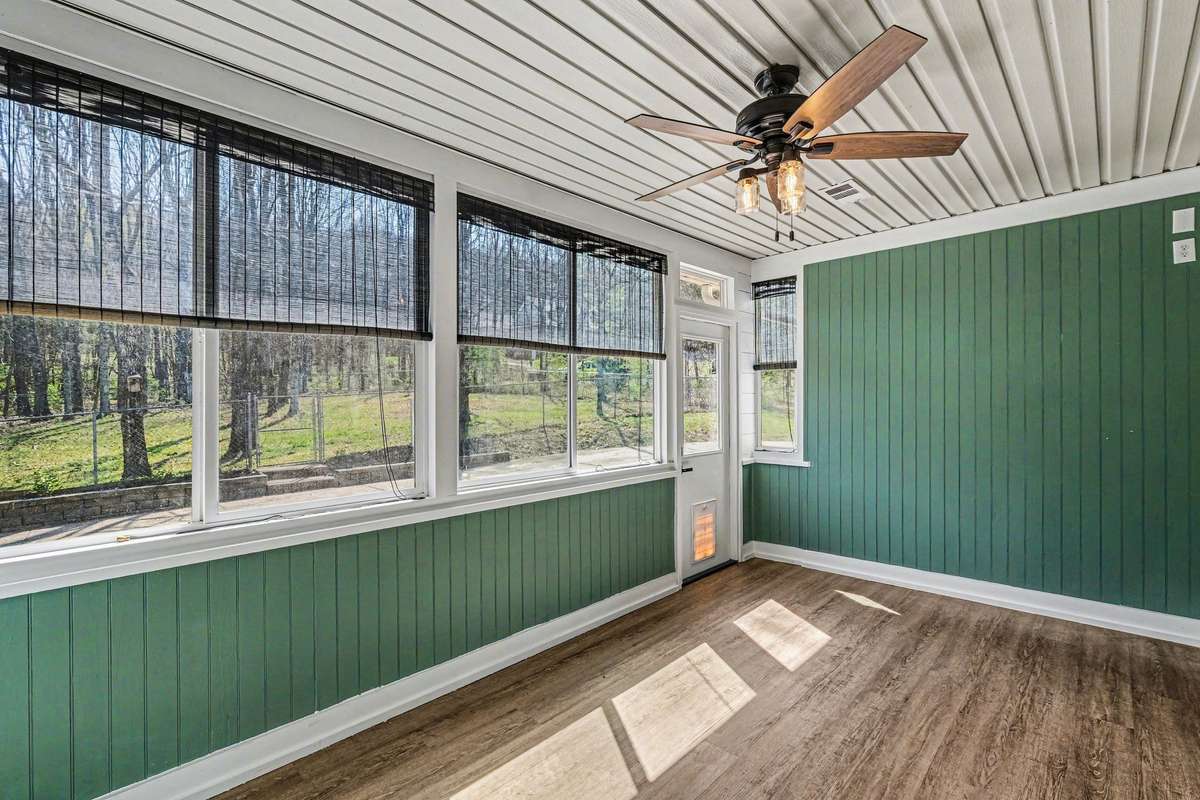 Off the living room, outdoor/ indoor living, with large Pella horizontal sliding windows
