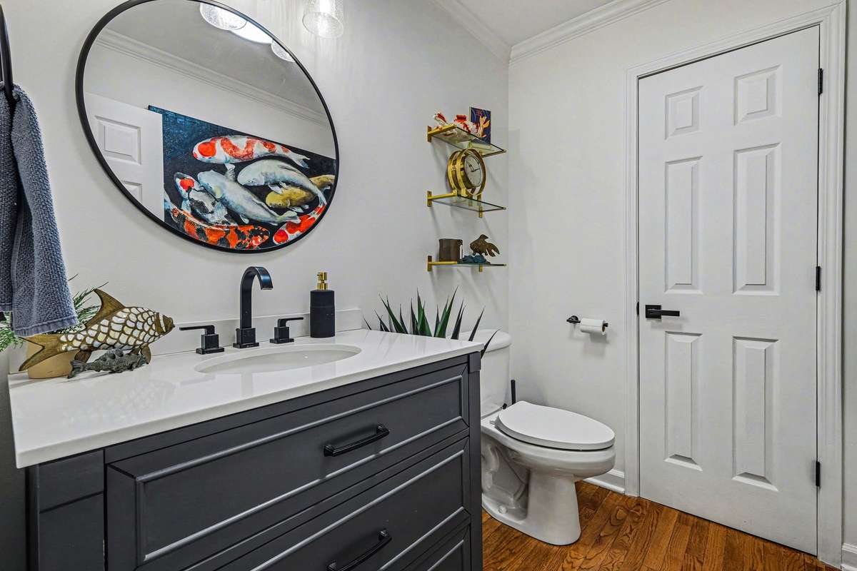 Completely redone, half bath off the main living area- with it's own linen closet