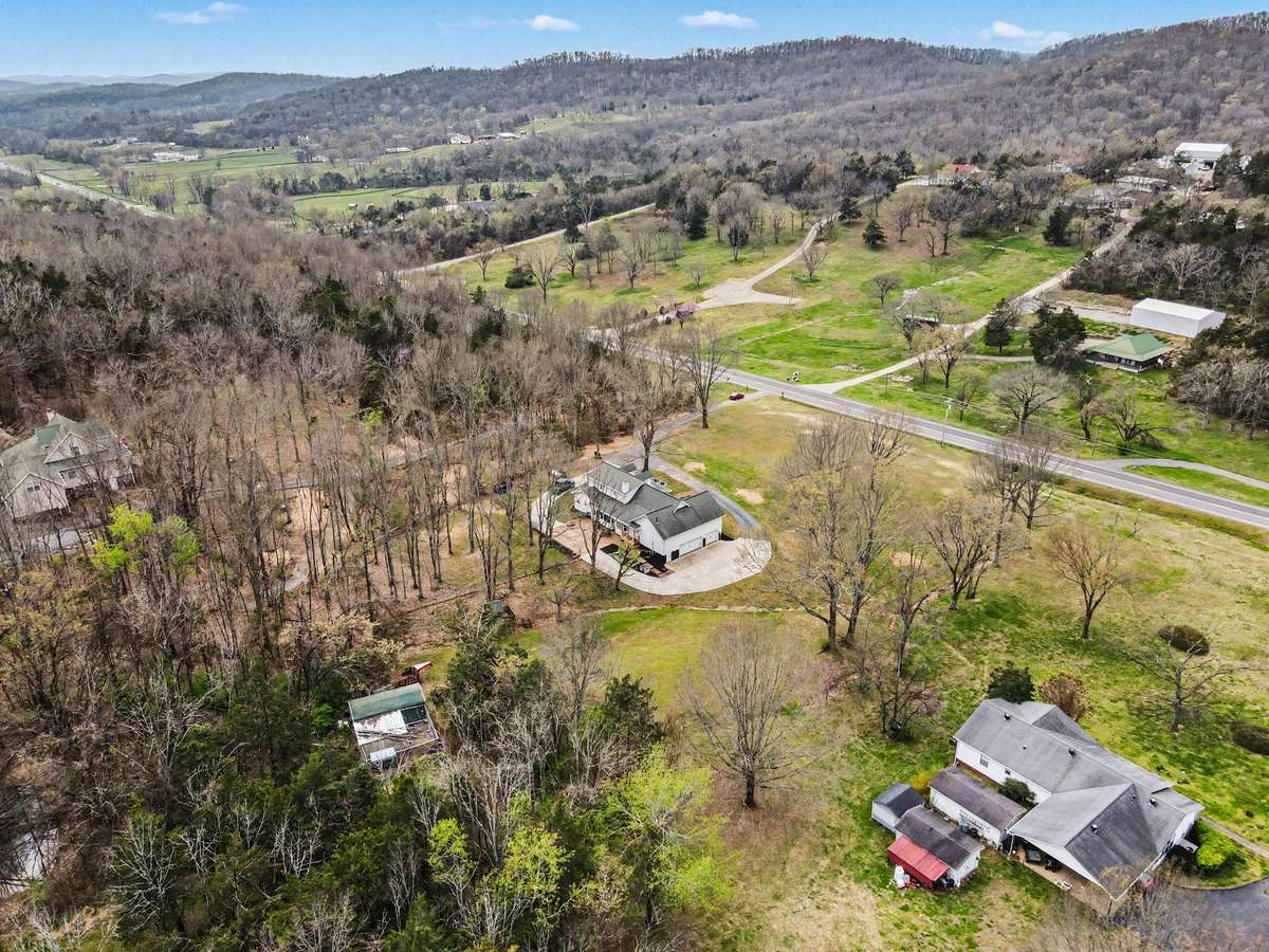 A wonderful mix of some cleared area and some woods- Also there is a shed that comes with the home