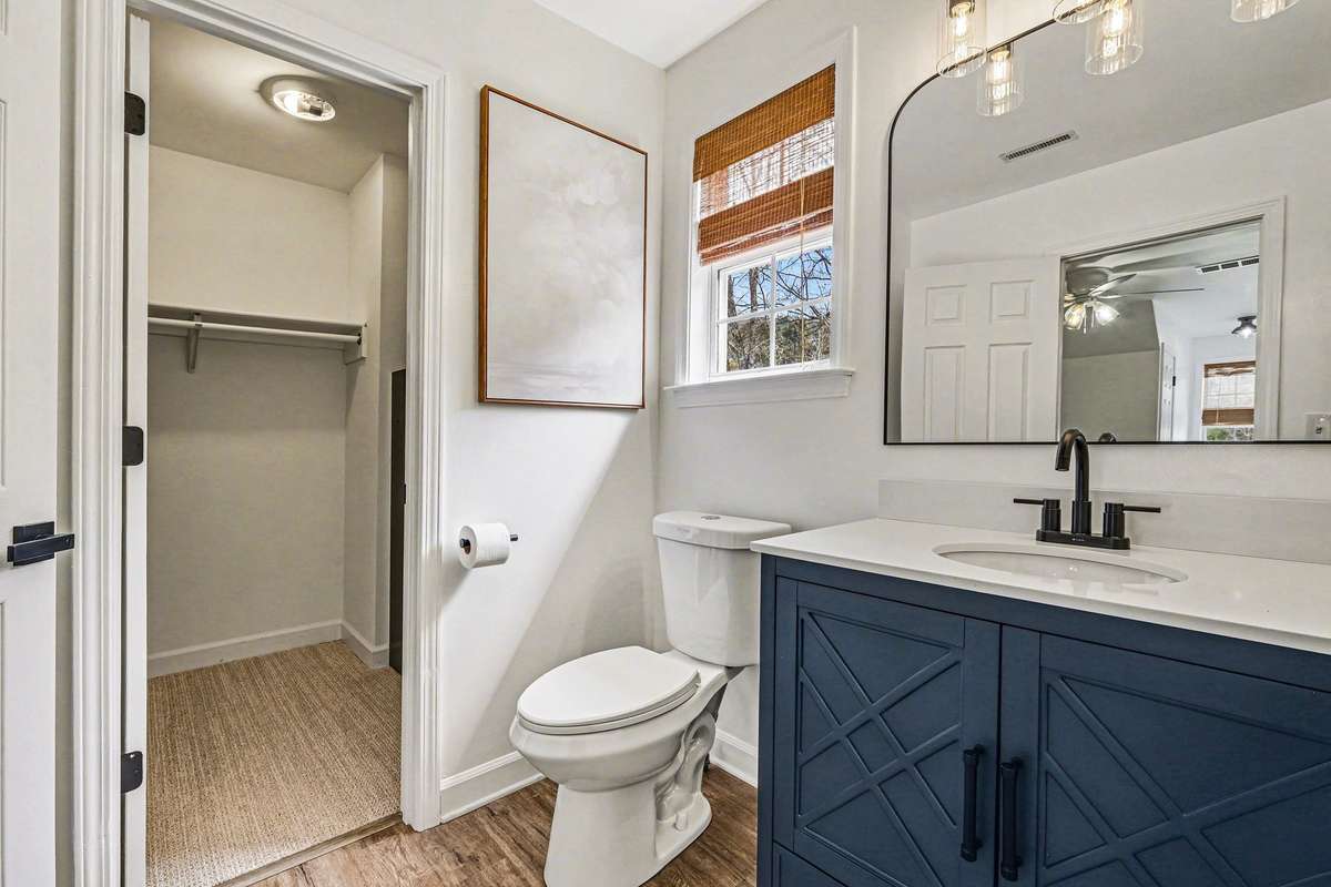 Anchored between the two bedrooms upstairs is a jack and jill bathroom. Completely remodeled with new floors, toilet, mirror, lights and vanity, they also each have their own walk in closets!