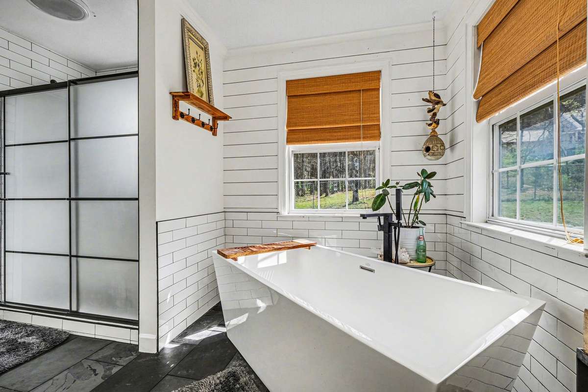 Separate tiled shower and tub, in the primary. ALL NEW!