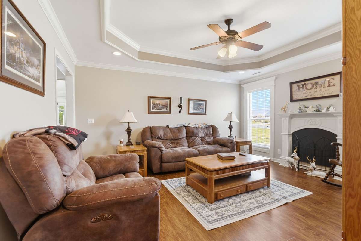 Great Room has trey ceilings and laminate hardwood flooring.