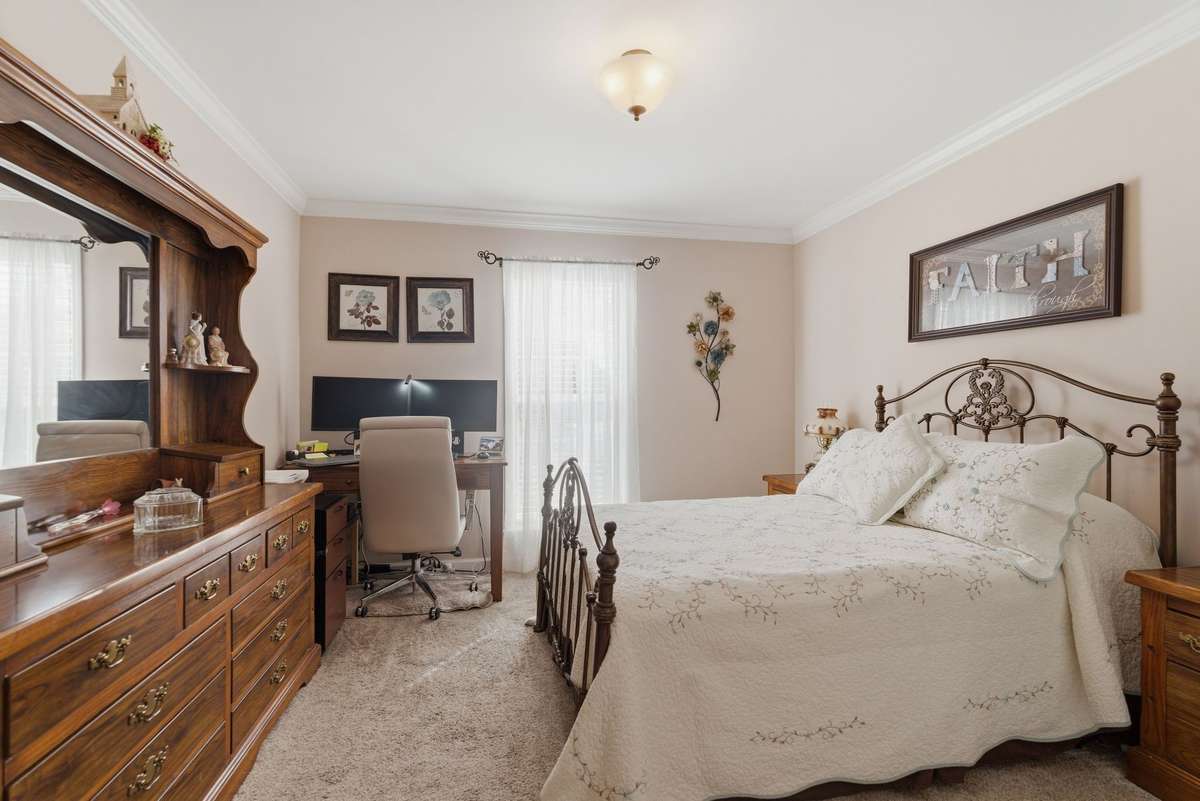 2nd bedroom features a large closet and crown molding