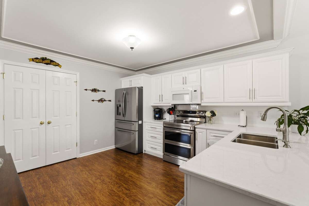 Kitchen features extensive trim work and a large pantry.