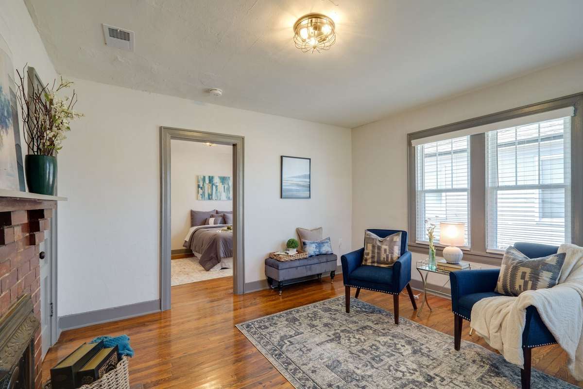 Unit A: Welcome to your spacious living room with windows, blinds and light fixtures replaced in 2021. Photos from 2021 renovation.
