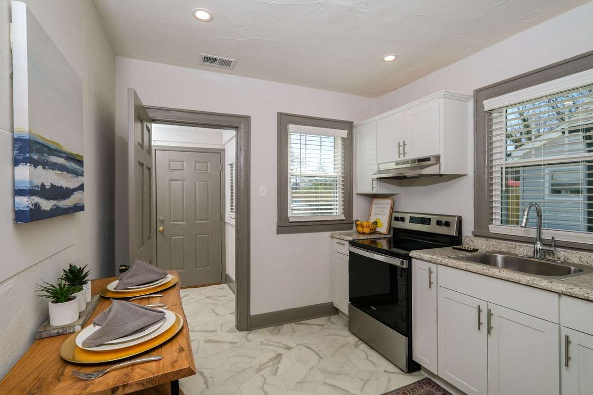 Unit A: Grab a bite and then head through your flex space to your private parking in the back. Photo from 2021.