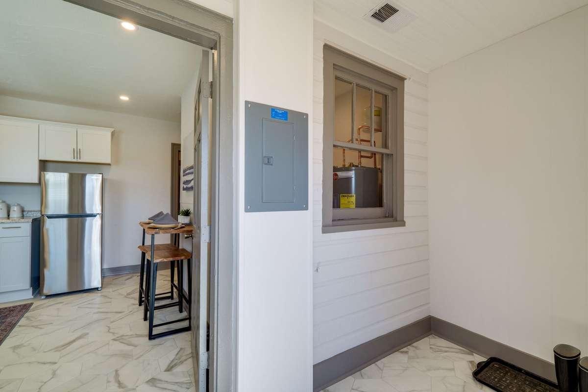 Unit A:  The flex space is where you will find the electrical panel and an original window. Photo from 2021.