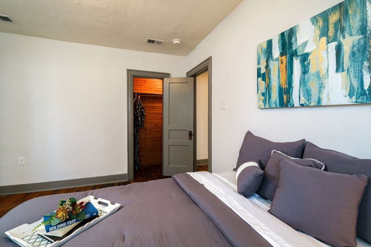 Unit A:  The bedroom also includes a closet and access to the hallway. 2021 Photo.