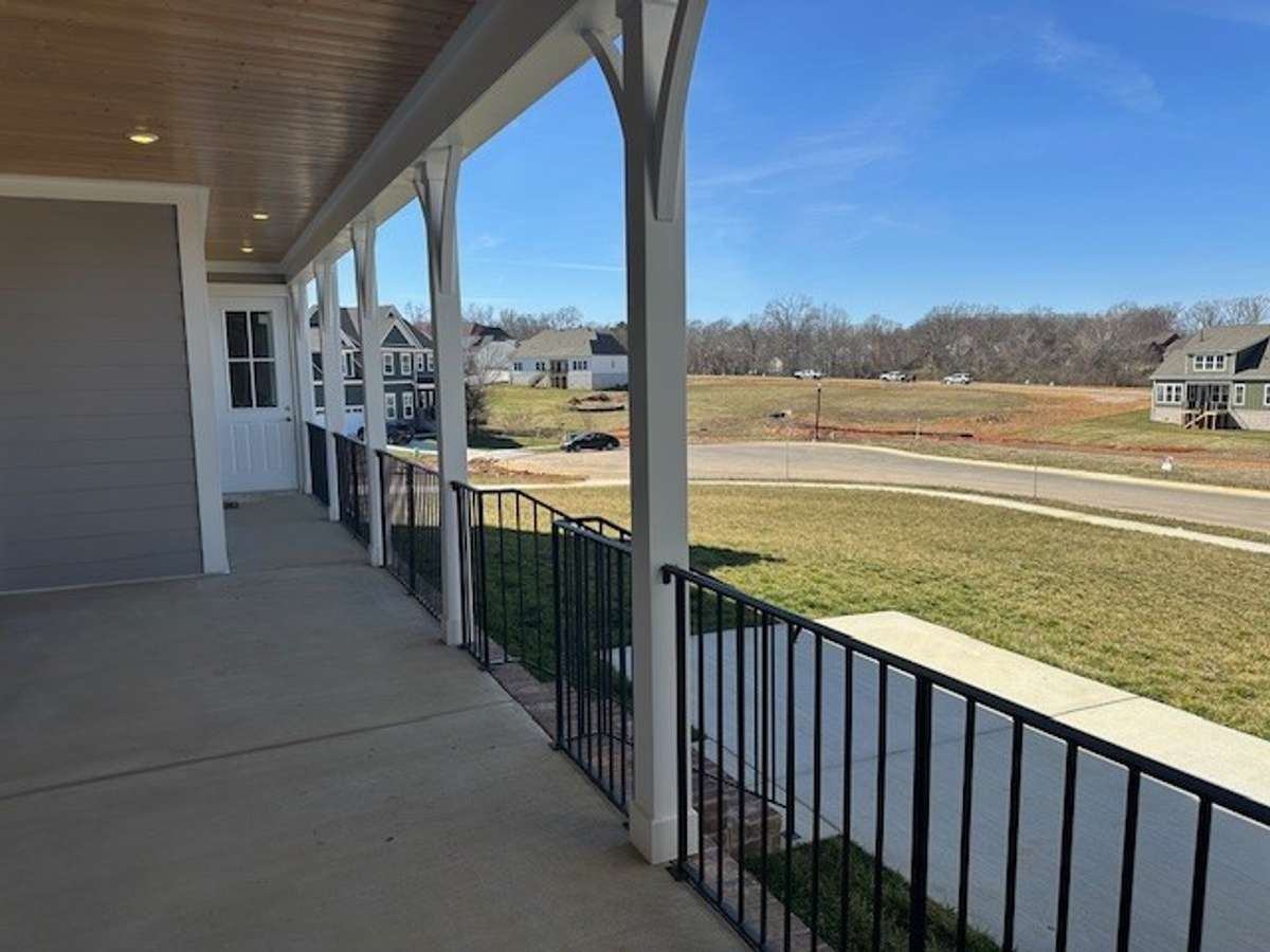 Your side porch leads to your garage through the breezeway, and to the patio off the porch. A perfect spot for morning coffee!
