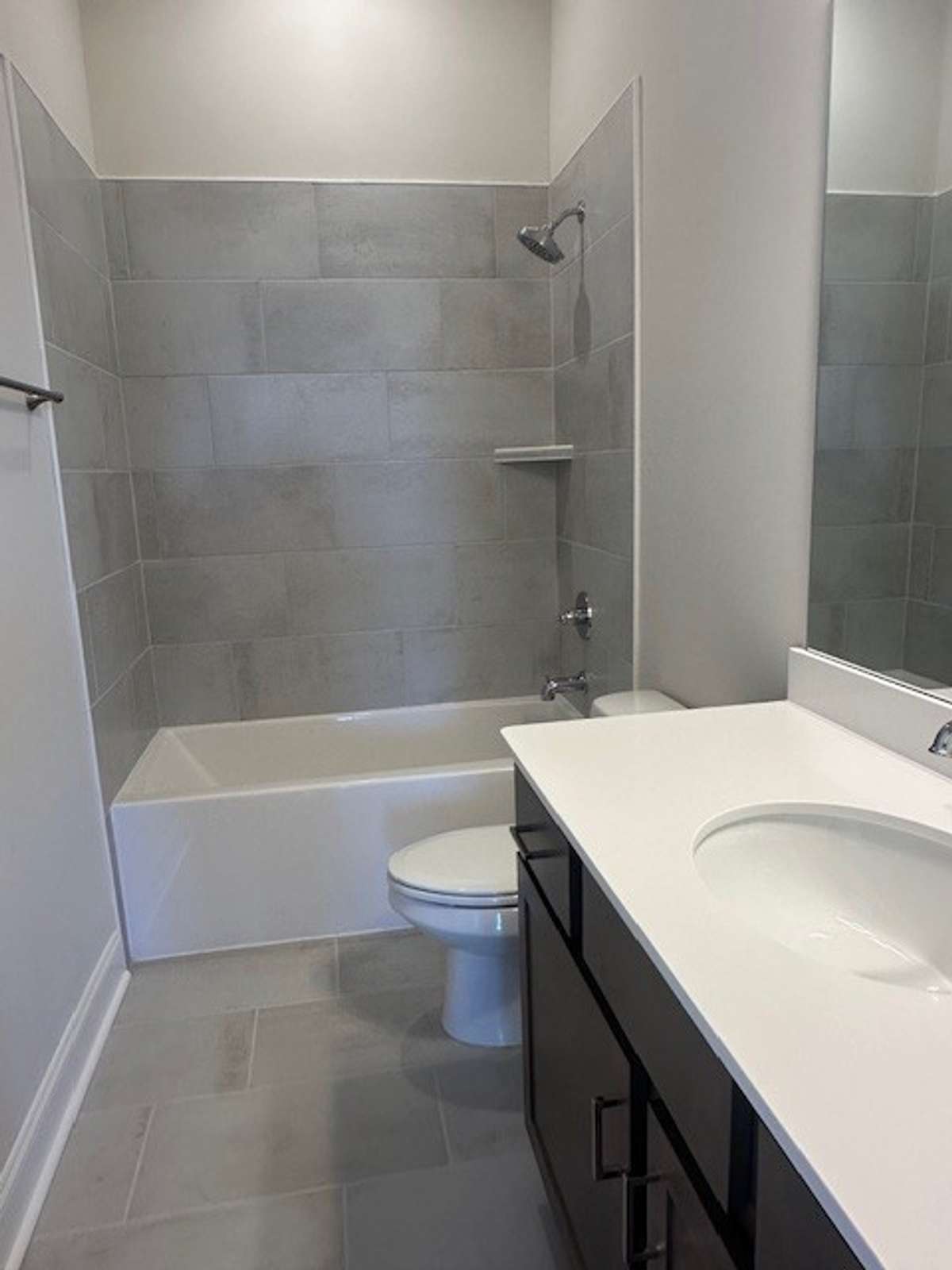 Full Bath downstairs off Bedroom 2 with beautiful tile surround