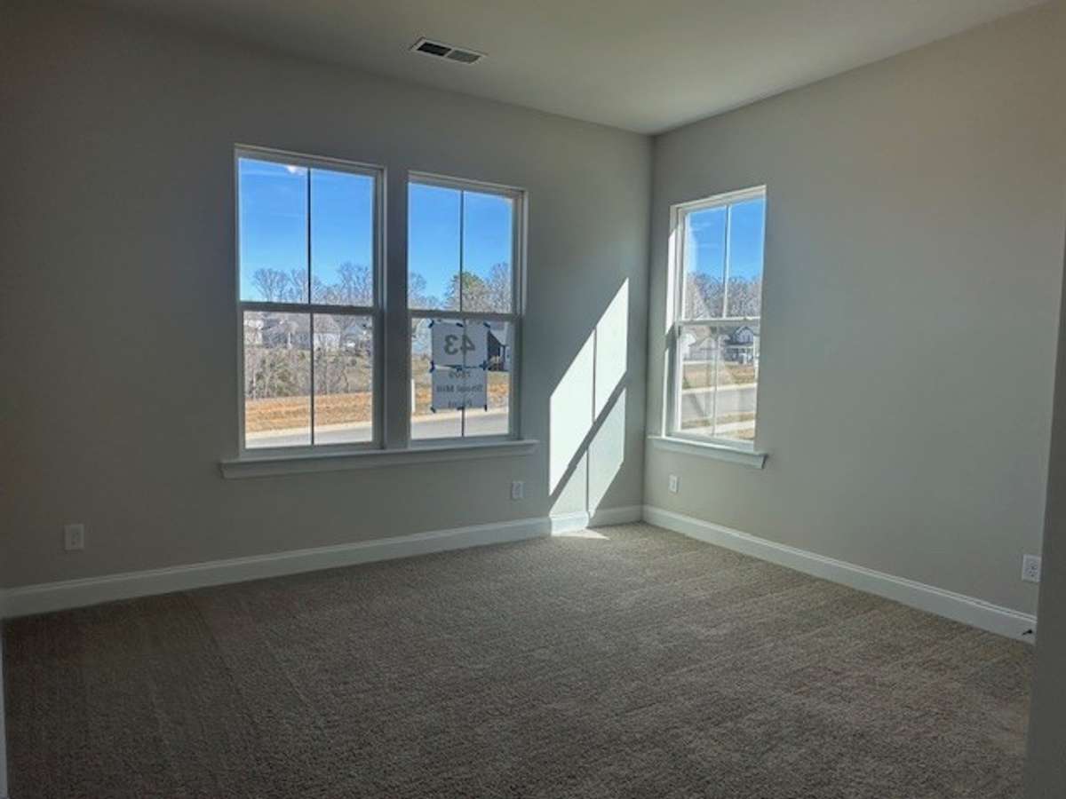 Bedroom 2 is on the main floor, with a full bath and 10' ceiling height!