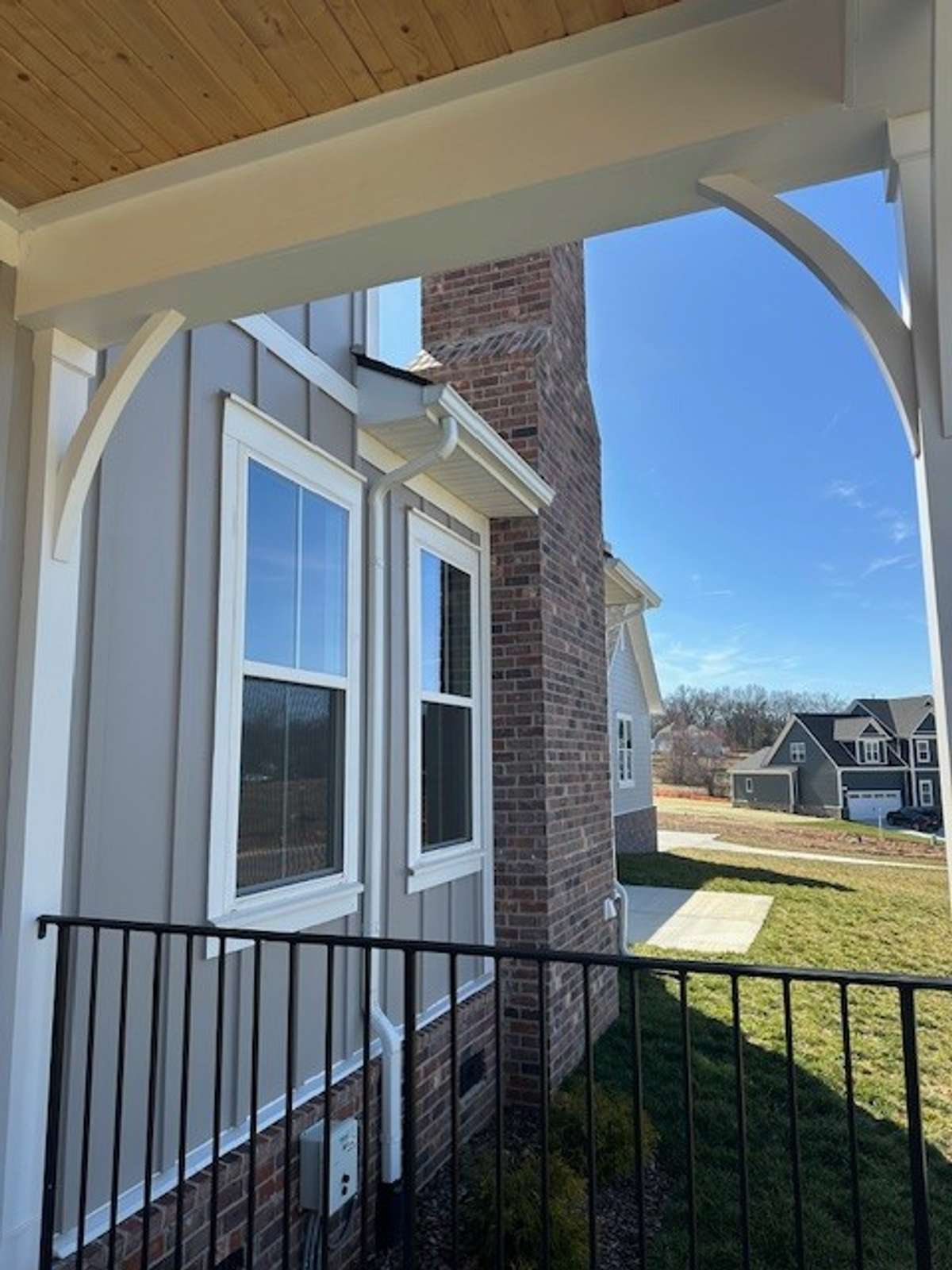 A view from the wrap around front porch leading to the stunning chimney!