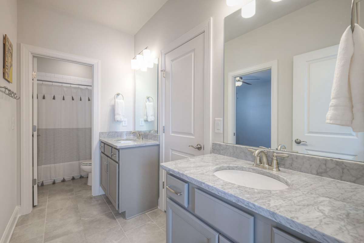 Upstairs bathroom with direct access to bedroom 2 and 3.