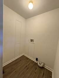 Utility room with pocket door separating it from bath.