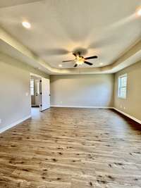 large master suite with trey ceilings and attached nursery/office space