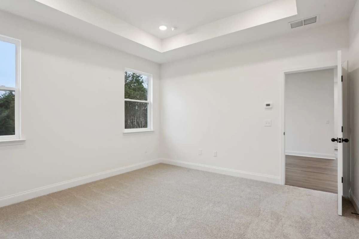 Blake first floor primary bedroom. Photos of similar home, same plan. Options may vary.