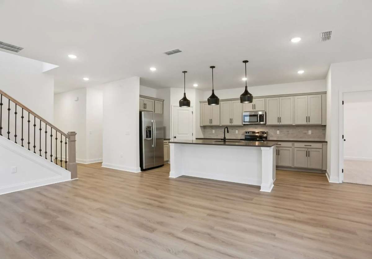 Blake living space and kitchen. Photos of similar home, same plan. Options may vary.