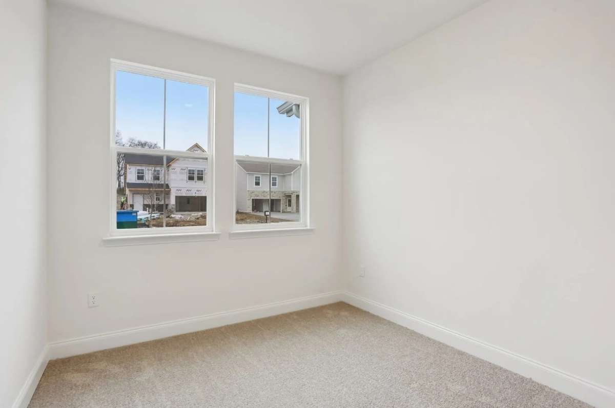 Blake first floor guest bedroom. Photos of similar home, same plan. Options may vary.