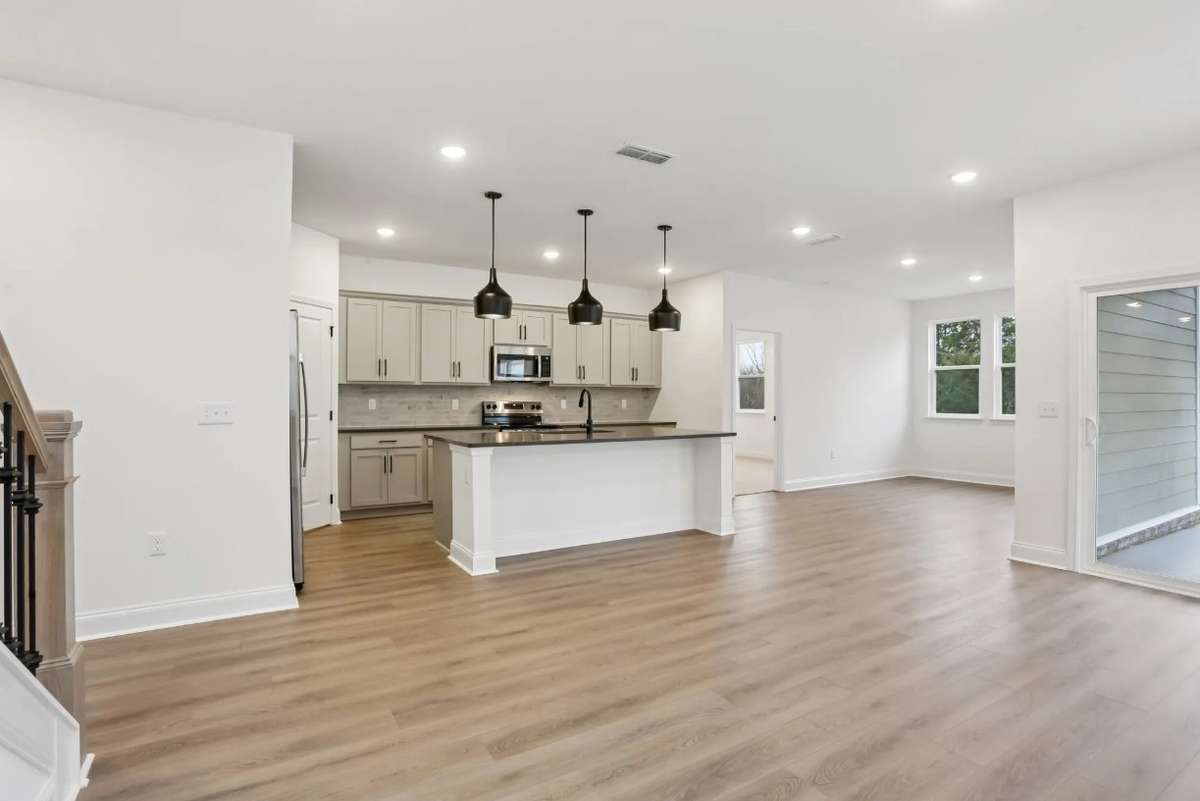 Blake kitchen and dining room view from living space. Photos of similar home, same plan. Options may vary.