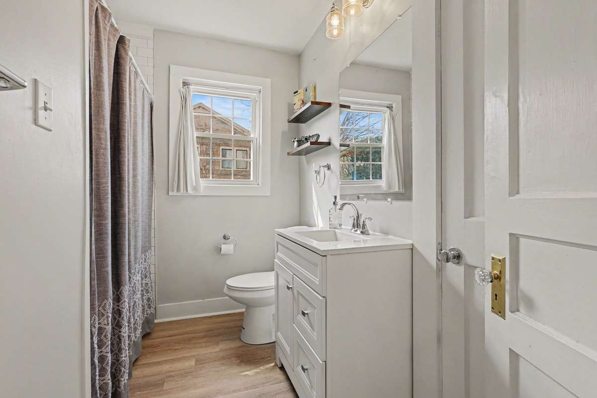 Full guest bath on the main floor with a tub and tile shower combo.