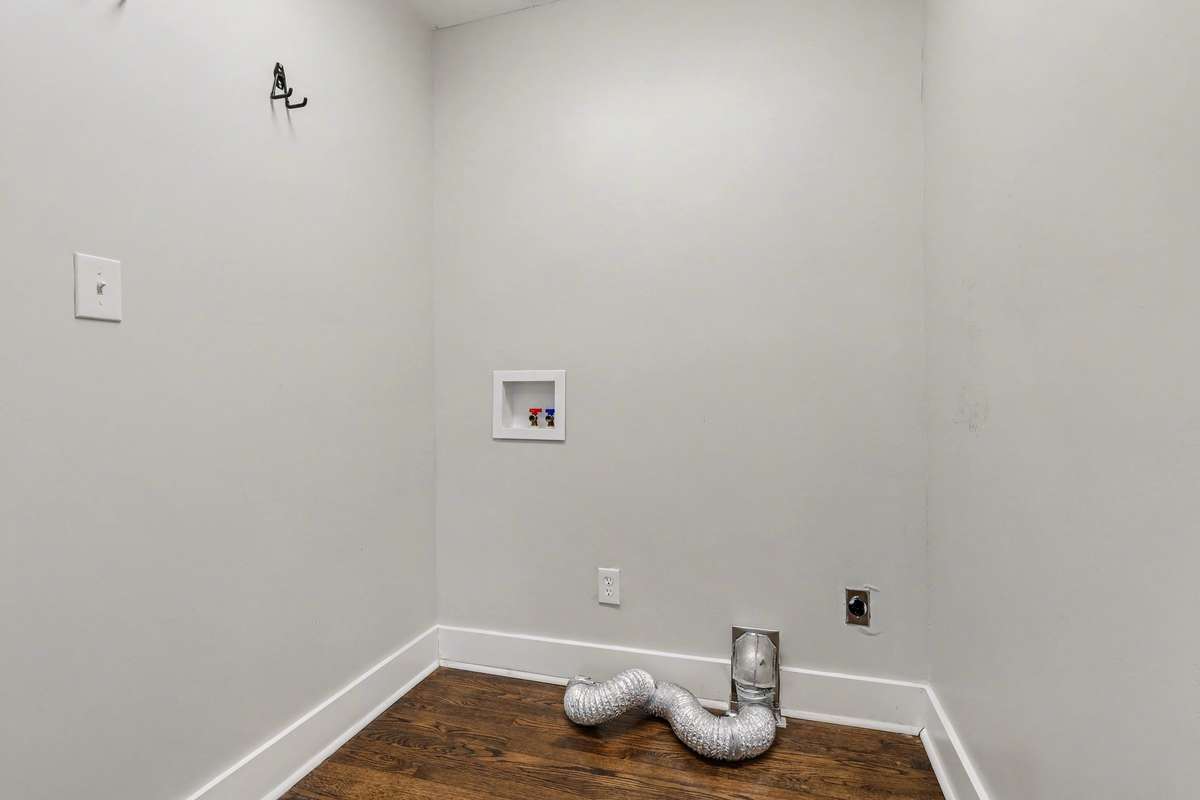 Accessible first floor laundry with electric washer and dryer hookups.