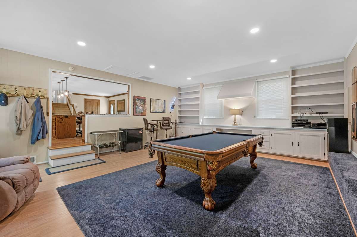 Walk into your bonus room. Pool Table does not stay. Look into your kitchen and dining area