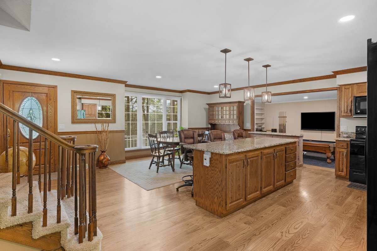 Stairs lead upstairs to 3 bedrooms including Primary and en suit bathroom