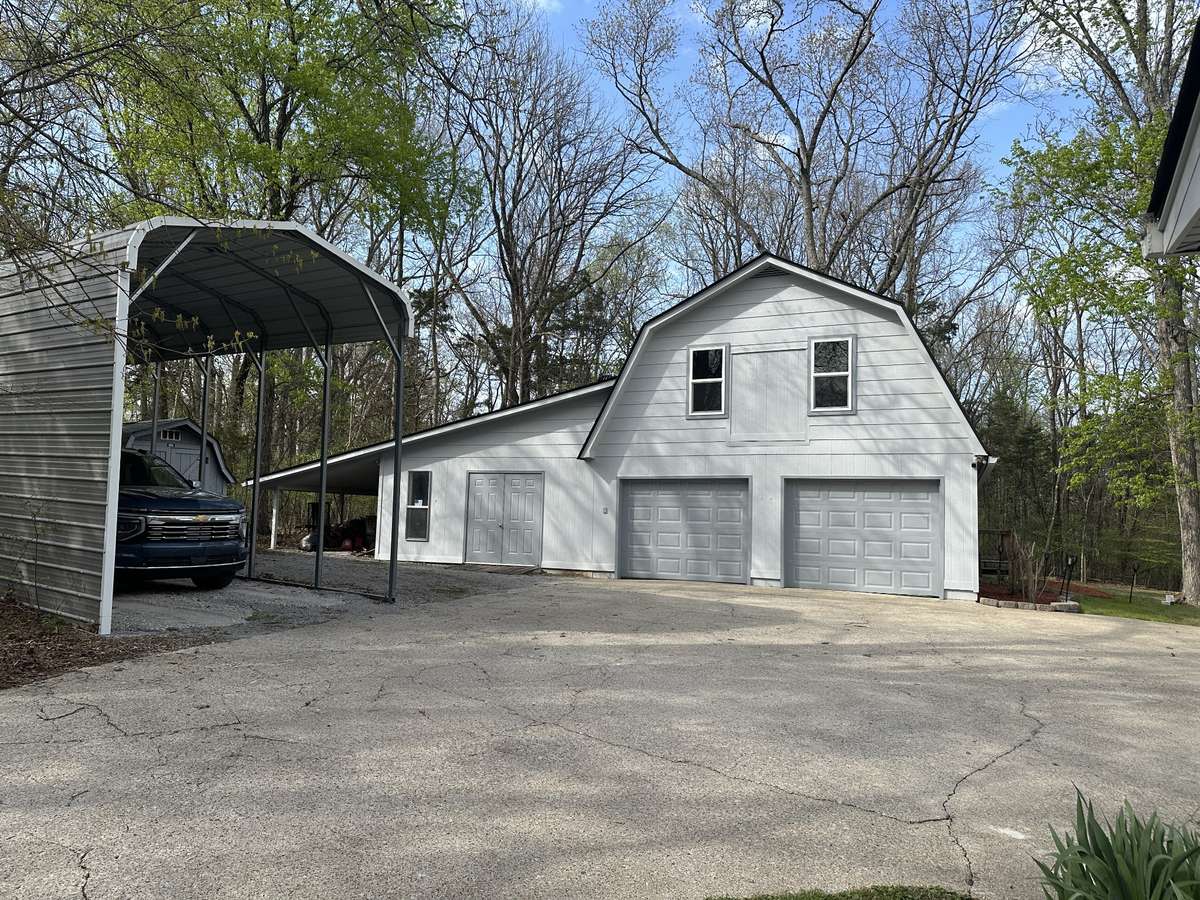 Heated and cooled shop 18x32 with Cooled bonus room and screened in deck.  PLUS 2 car garage