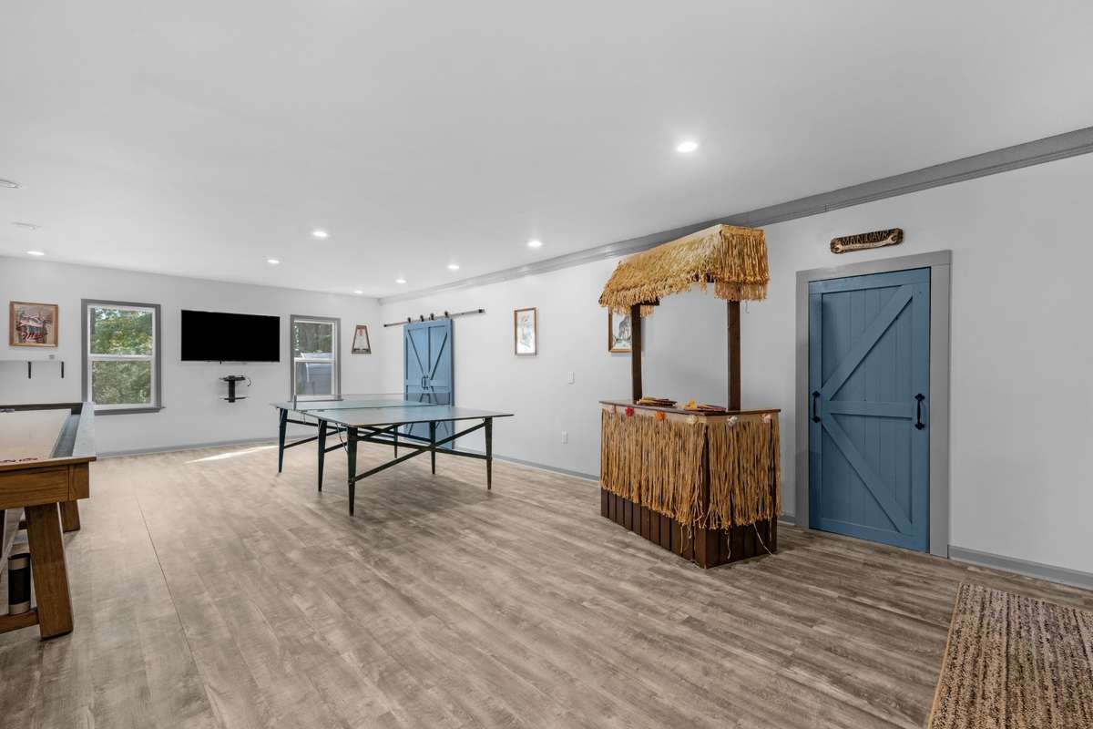 Shuffle board Table (stays) Ping Pong Table (does not stay) custom made Tiki Bar (stays)