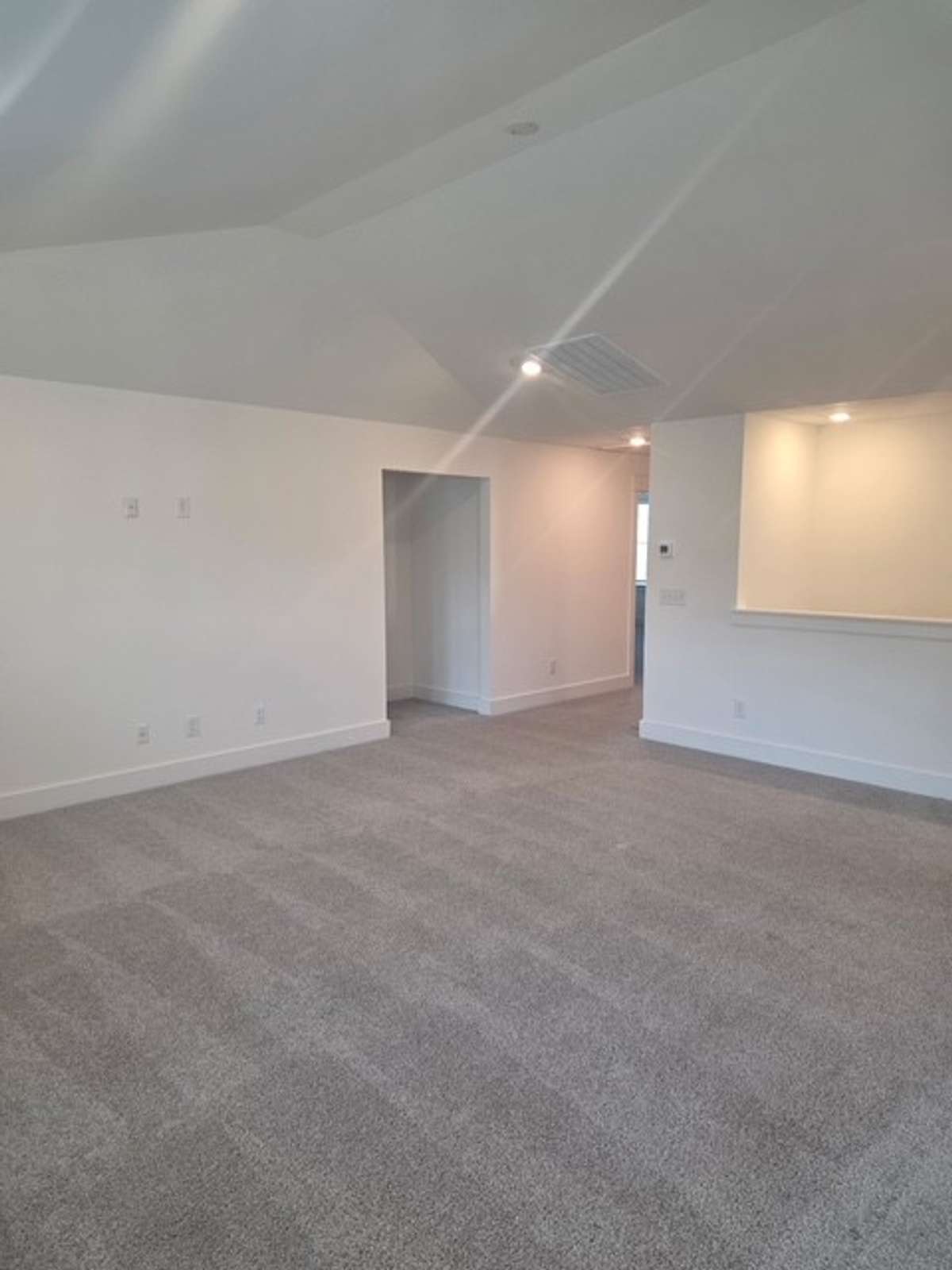 Spacious loft space on second floor with vaulted ceilings