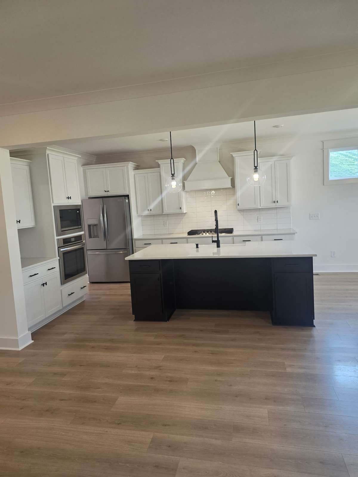 Luxury kitchen with wall oven/microwave combination and gas cooktop.
