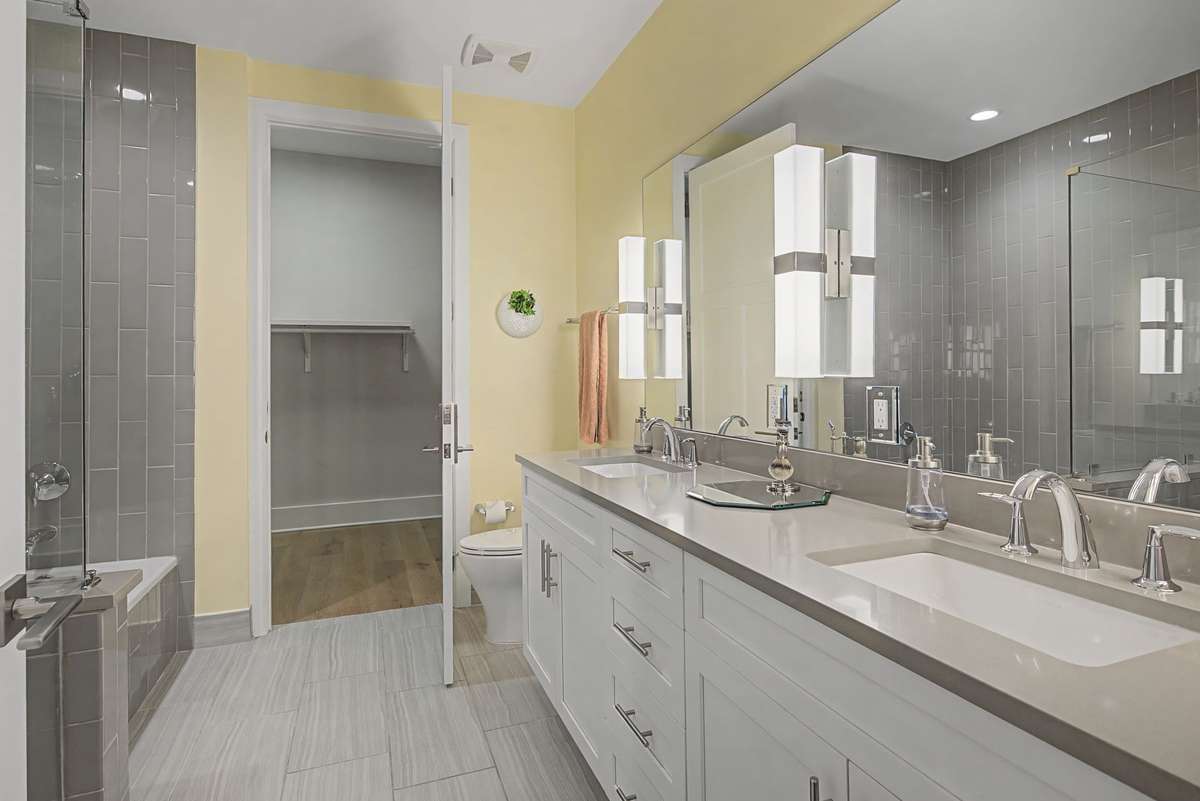 Main Bathroom Suite with Separate Shower & Tub along with double vanities