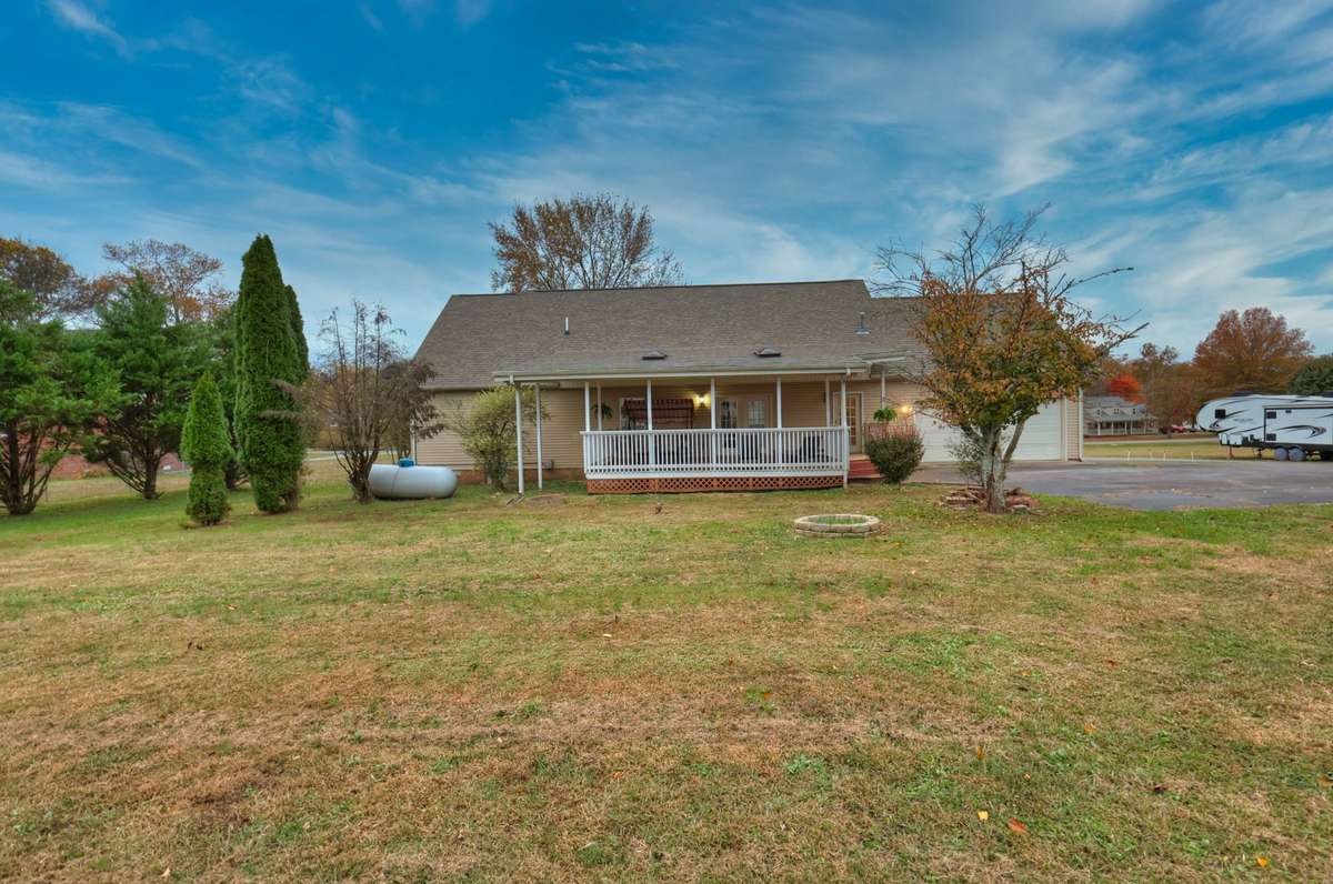 Back of house with large yard.