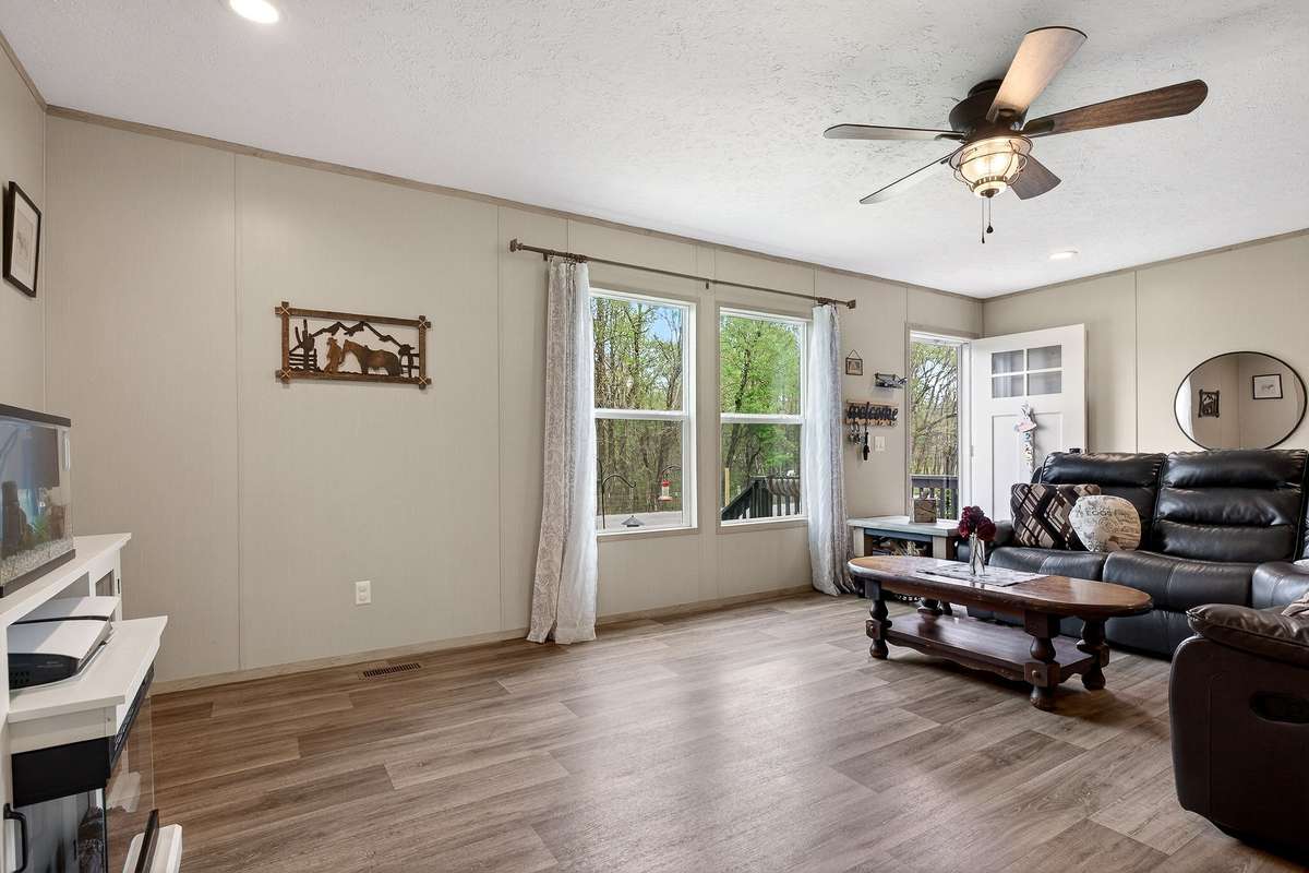 So much natural light in this home, and LVP flooring for easy maintenance.