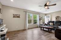 So much natural light in this home, and LVP flooring for easy maintenance.