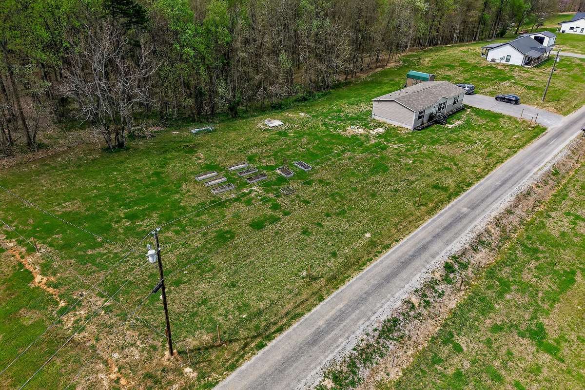 Relax and unwind on your very own 5 acres. You’ll love evening here at one of the two firepits watching the stars. Wide lot for a garage, large garden, fence for pets.