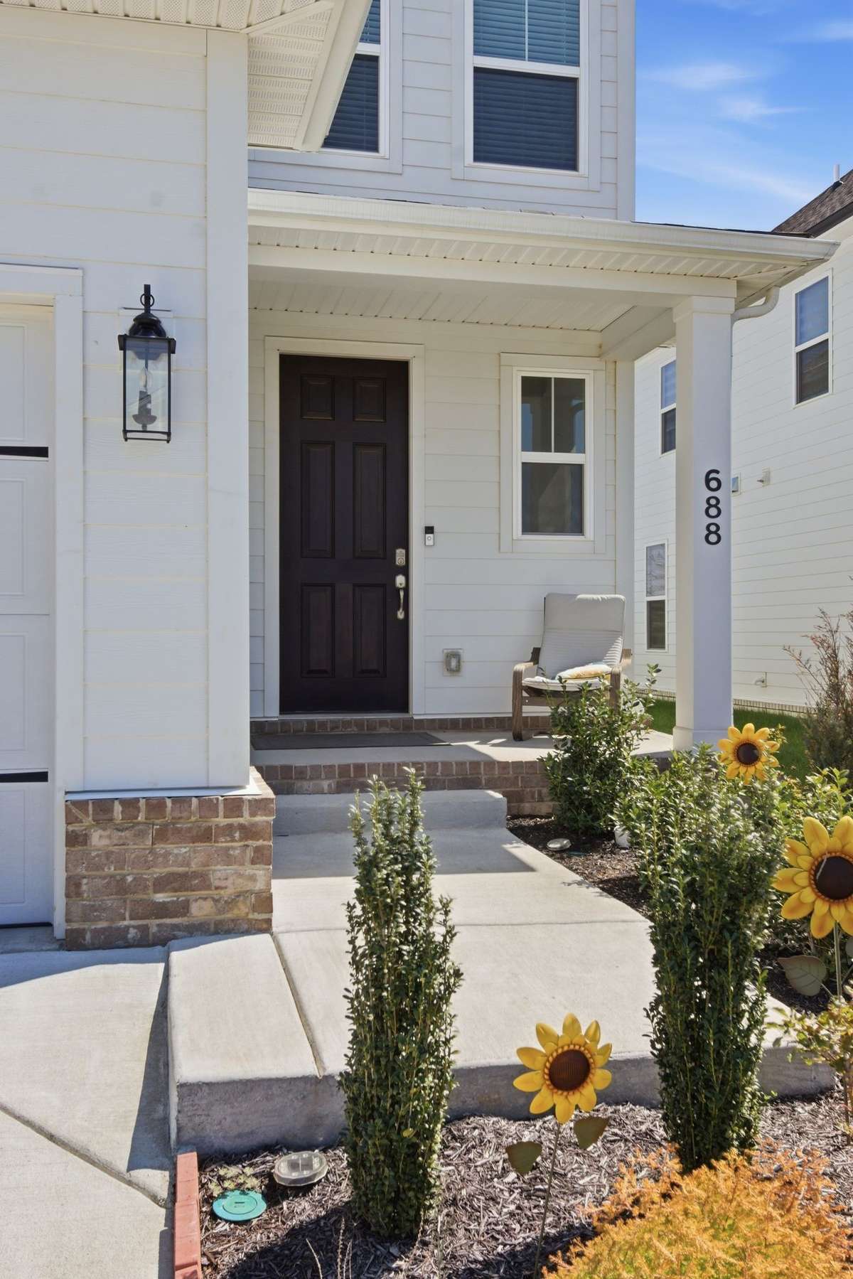 Welcoming covered front porch and main entryway.