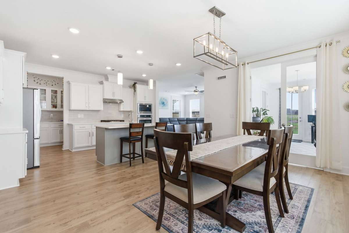 Stunning open floor plan seamlessly connecting the kitchen, dining, and living areas.