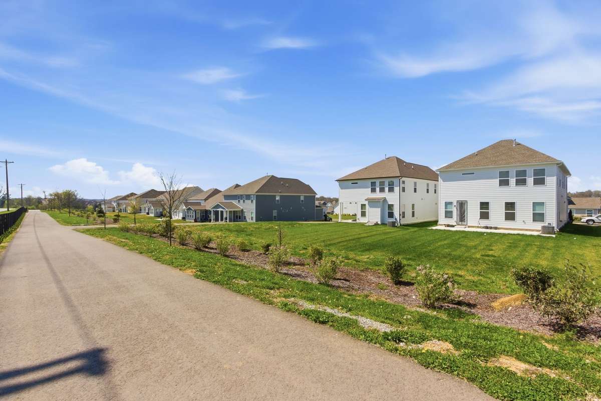 Scenic community paved walking trail located right behind the property.