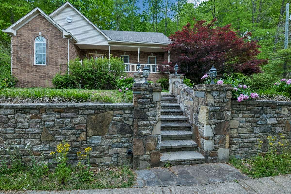 The yard has beautiful stonework terracing the yard to provide lots of greenspace.