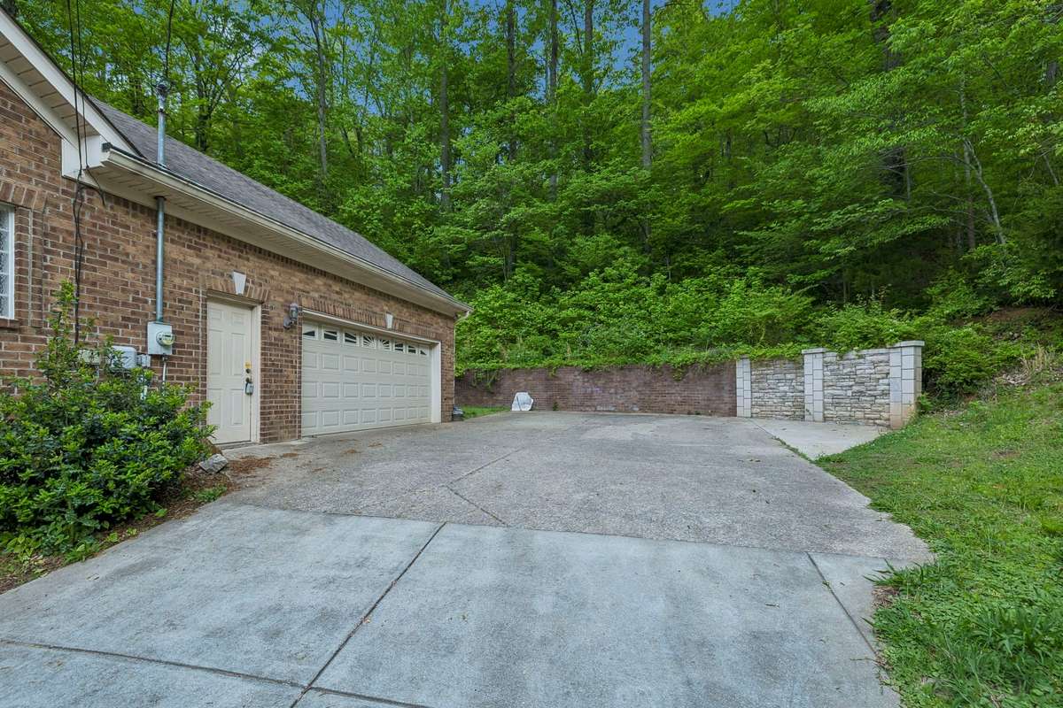 2 Car garage and pedestrian door.  Retaining walls are still in excellent condition.