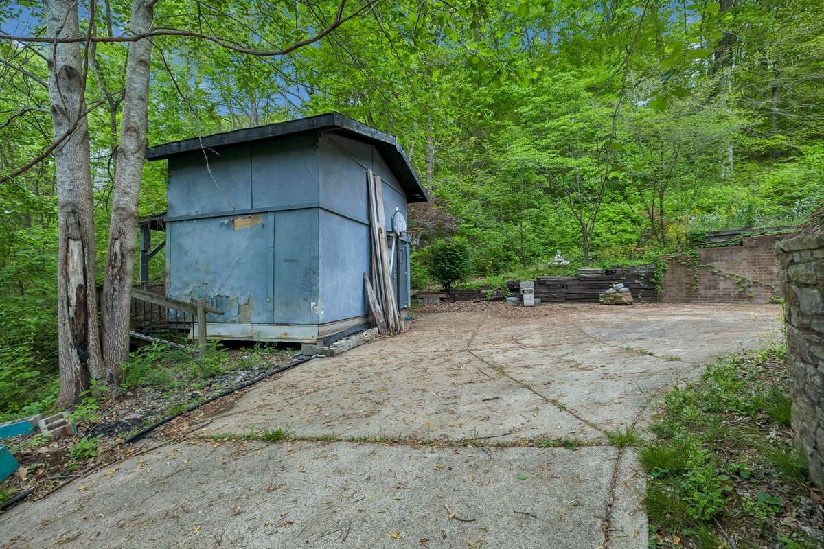 Small shed outside the basement entrance remains.