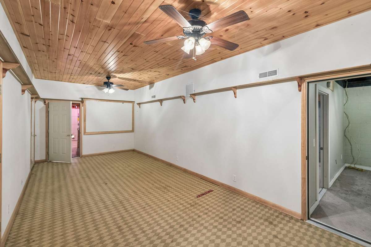 Second finished room in the basement.  This connects to the open area/unfinished area of the basement.