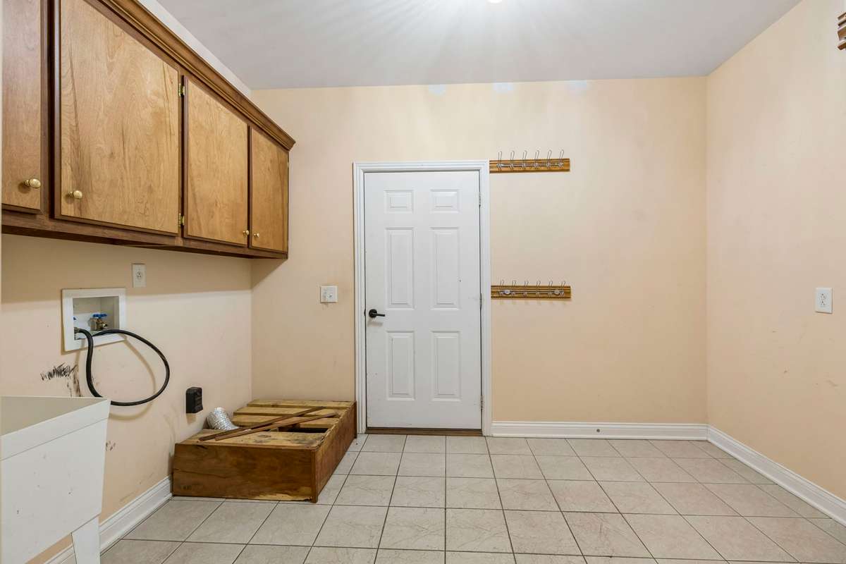 Extra large laundry room with a sink, just off of the 2 car garage.  Great area for a drop zone/mud room.