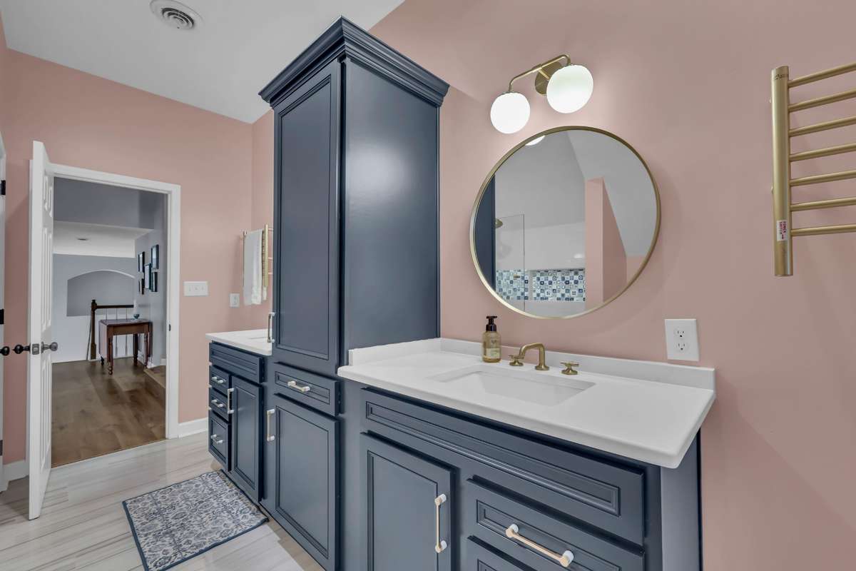 Bath on 2nd level renovated with charming gold fixtures including towel warmers